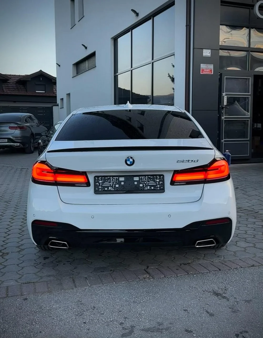 BMW G30 rear exterior during facelift conversion