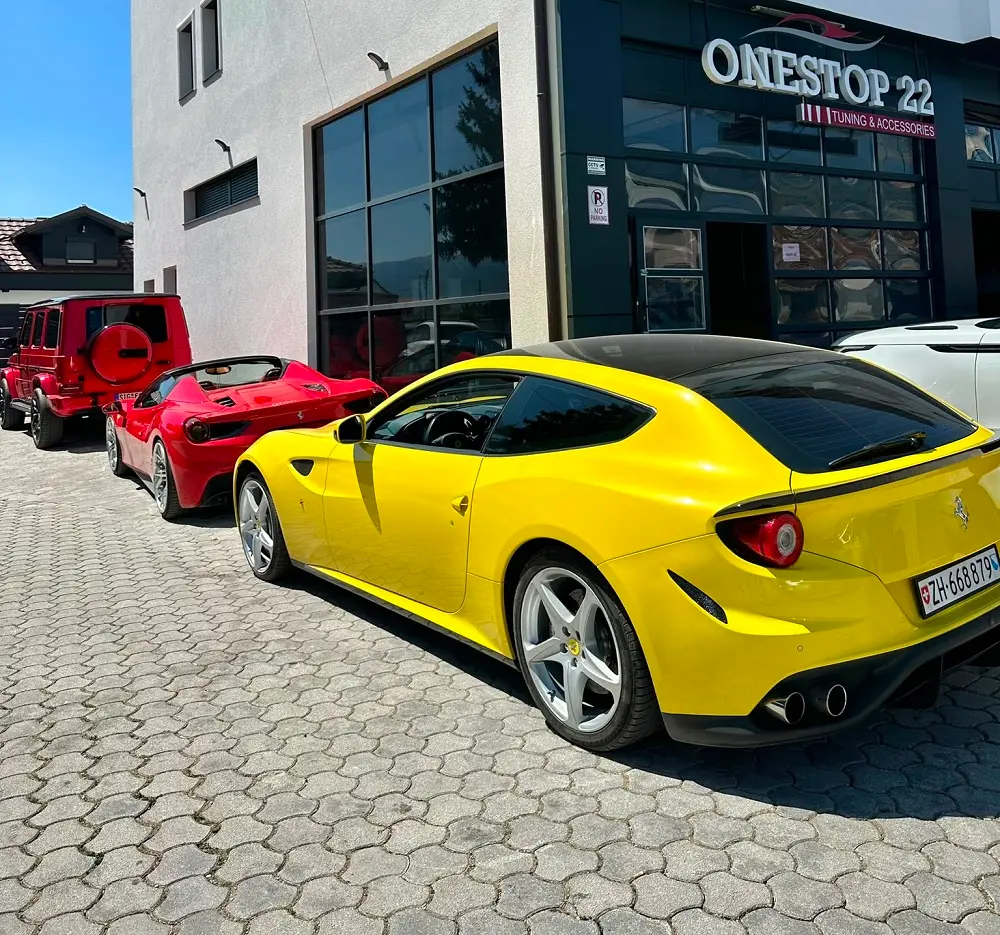 Ferrari FF Ferrari 488 Spider and Mercedes-Benz G-Class luxury vehicles together